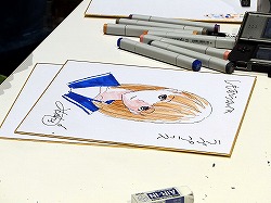 画像ギャラリー No.016のサムネイル画像 / ［TGS 2009］“自分の彼女”の似顔絵をミノ☆タロー氏に書いてもらえる抽選イベントも。「ラブプラス」の「デキシーズ 幕張出張所」レポート